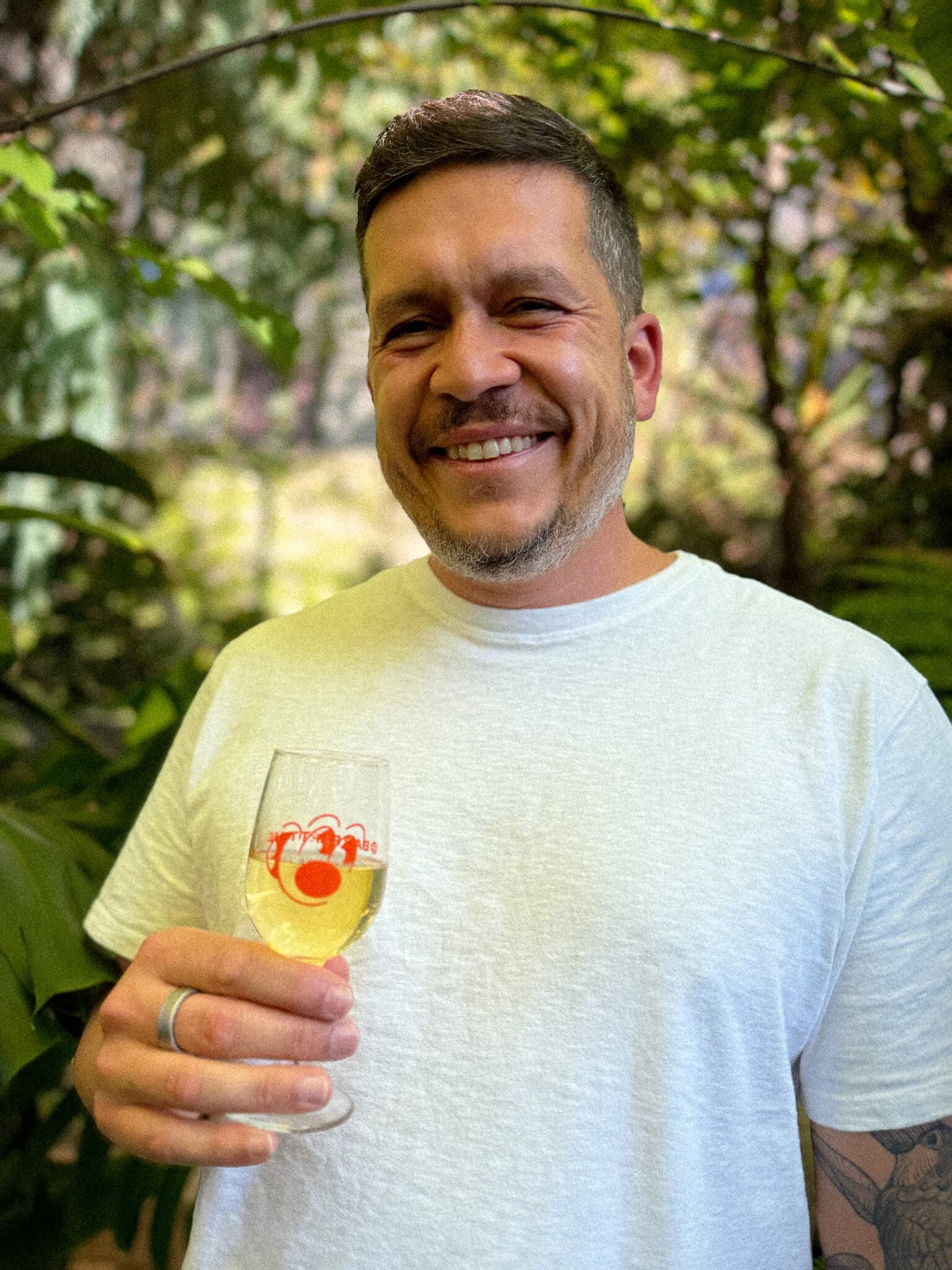 Xande smiling outdoors